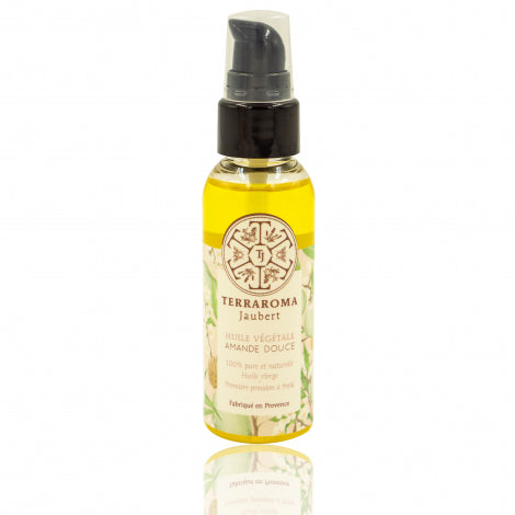Flacon pompe de 50 ml d'huile végétale d'amande douce de la marque Terraroma Jaubert, fabriquée en Provence. L'étiquette présente un design floral délicat avec un logo au centre. L'huile, de couleur dorée, est mise en avant comme un produit naturel et pur, idéal pour le soin de la peau.