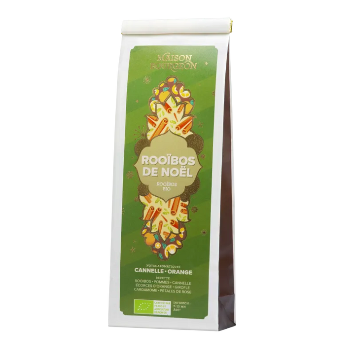 Paquet de rooibos "Rooibos de Noël" de la Maison Bourgeon, au design vert et doré. Ce mélange bio est aromatisé avec des notes de cannelle et d'orange, et contient des pommes, écorces d'orange, girofle, cardamome et pétales de rose. Une infusion aux saveurs épicées et fruitées, parfaite pour célébrer les fêtes de fin d'année.
